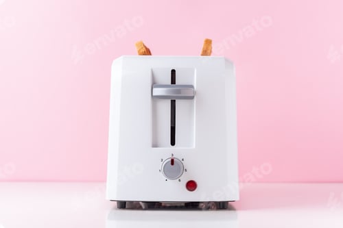 Preview: White toaster with roasted toast bread on pink background, close up