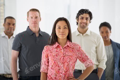 Preview: Business people, a multi ethnic group, men and women standing together in a group.