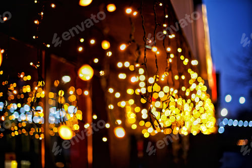 Preview: Winter Christmas background of the decorated lights on the street