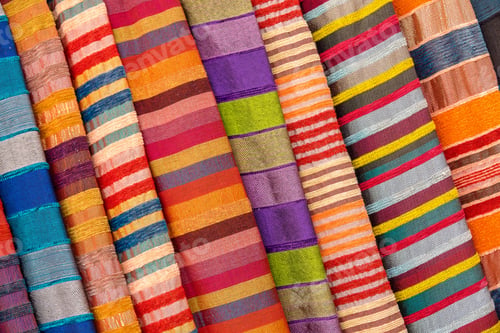 Preview: Top view of colorful fabric sold in the open-air market in Morocco