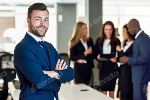 Preview: Businessman leader in modern office with businesspeople working