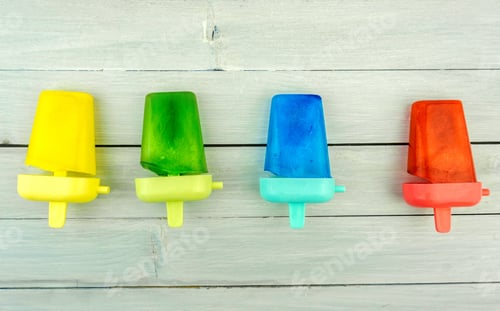 Preview: Colorful popsicles on white table