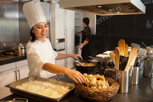 Preview: Cheerful chef preparing a delicious stirfry in a bustling kitchen