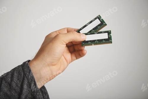 Preview: Man's hand holding RAM