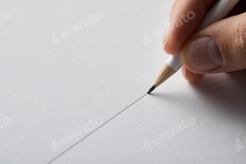 Preview: cropped view of man drawing line on paper with pencil