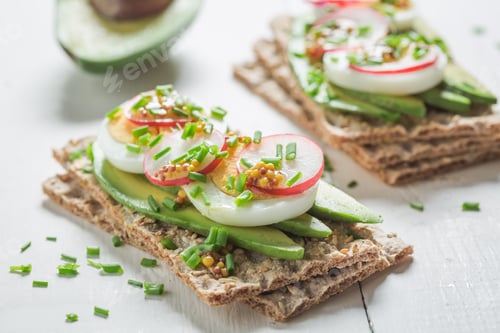 Preview: Fresh sandwich with avocado, eggs and radish