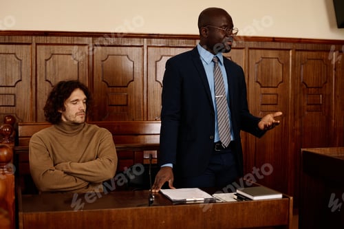 Preview: Confident African American male attorney explaining points of case to judge