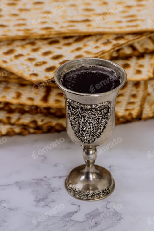 Preview: During the Jewish holiday of Pesach, a cup of kosher kiddush wine is with unleavened bread called