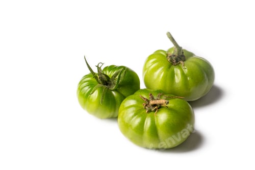 Preview: Green raw tomatoes on the white background.
