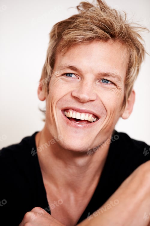 Preview: Sensational smile. Cropped shot of a handsome young man posing in studio.