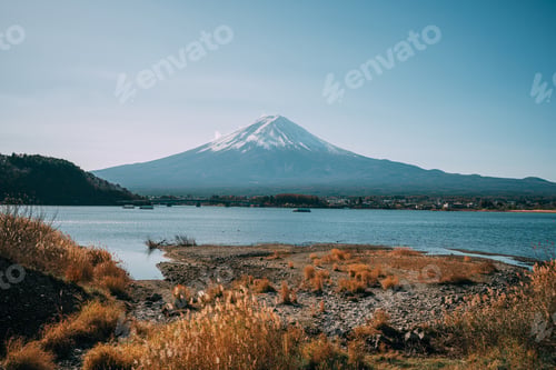 Preview: Mountain Fuji with morning fog and red leaves at lake Kawaguchiko.