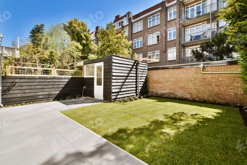Preview: Picturesque Urban Garden with Green Lawn and Shed