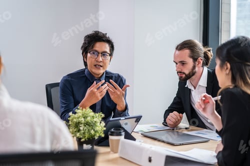 Preview: Group of multi-Ethnic businessman and businesswoman working in office.