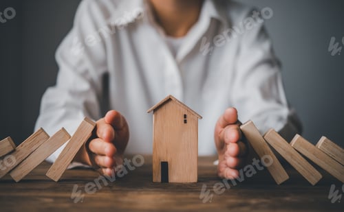 Preview: hand stopping risk the wooden blocks from falling on house, Home insurance