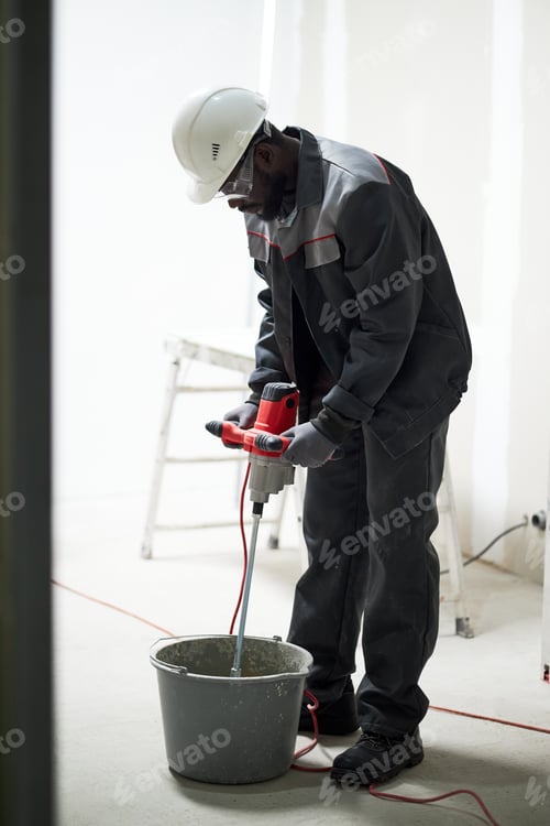 Preview: Worker Using Drill Mixer