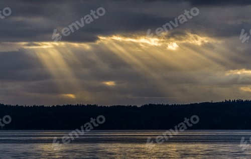 Preview: Rays Of Sunligh Break Through Dark Clouds Over The Puget Sound In Washington State.