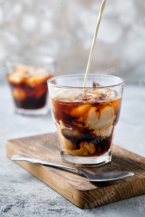 Preview: Pouring cream in iced coffee