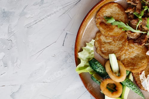 Preview: Cropped topview of tasty potato puncakes breakfast
