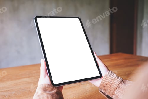 Preview: Adult Holding Digital Tablet with Blank Screen Indoors