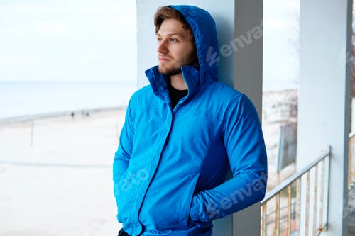 Preview: Freezed man in blue hoodie.