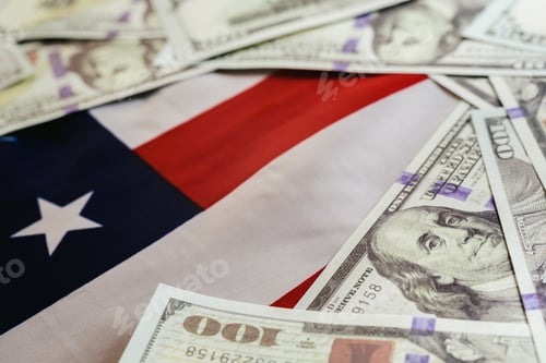 Preview: Stack of 100 dollar bills on american flag.