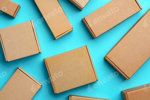 Preview: A collection of cardboard boxes arranged on a bright blue surface