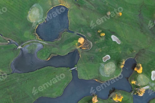 Preview: Aerial of a golf course in autumn, showing the composition of the terrain.