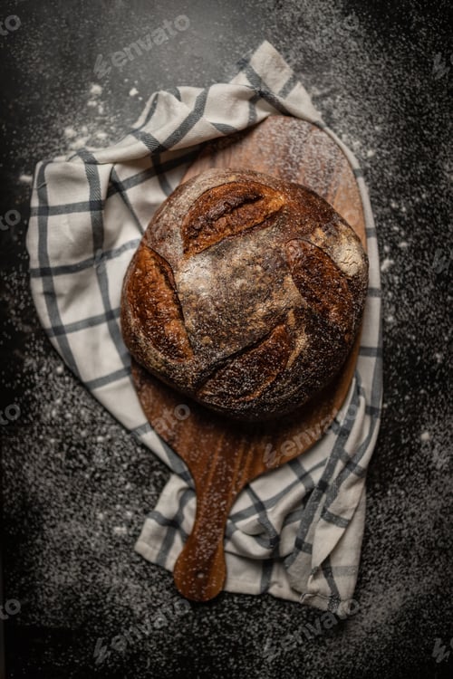 Preview: Overhead shot of freshly baked bread on a wooden board