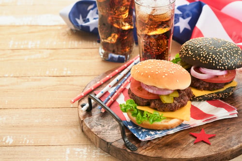 Preview: 4th of July American Independence Day traditional picnic food. American Burger and cocktail, America