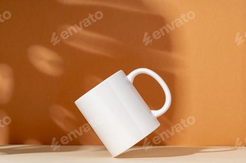 Preview: White ceramic mug on peach background with shadows