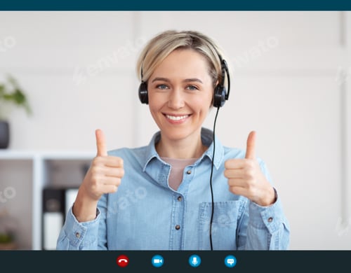 Preview: Young woman in headphones smiling and showing thumbs up gesture on device screen, making video call