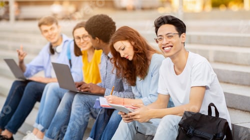 Preview: Asian guy studying outdoors with his friends