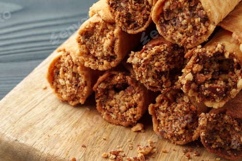 Preview: Waffle tubes with chocolate filling on wooden board