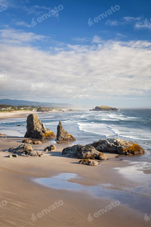 Preview: Dramatic sea stacks rise from the sandy shoreline of Bandon Beach, Oregon