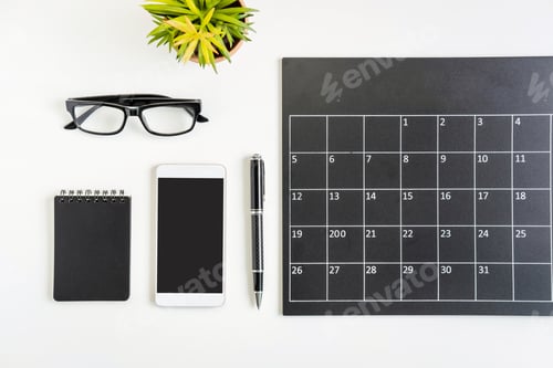 Preview: Planning calendar with smartphone on business desk office, Top view