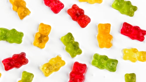 Preview: Sweet bears on white background. Stock clip. Bright sweet background with delicious bears. Colorful