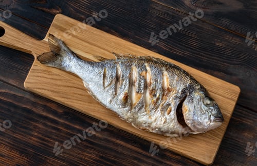 Preview: Grilled fish on the wooden board