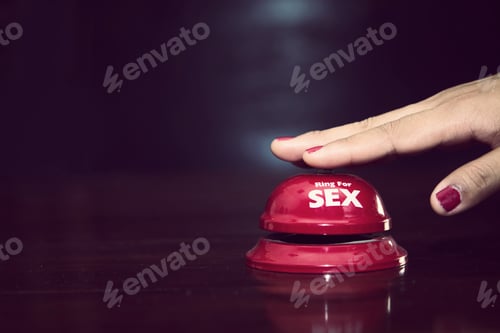Preview: woman's hands press sex bell on a reception bell. concept about sex and eroticism
