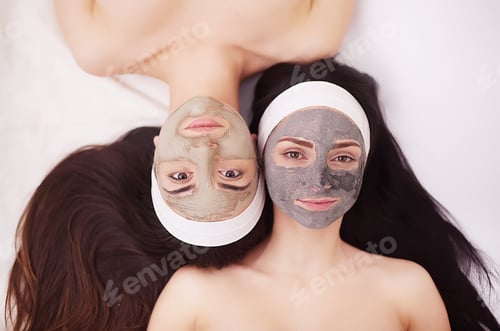 Preview: Two girls are relaxing during facial mask application in spa