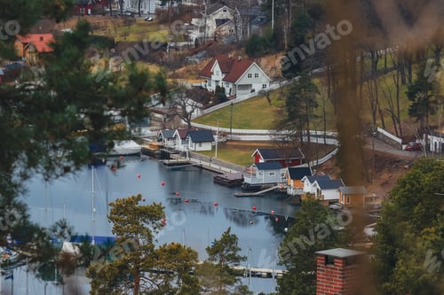 Preview: Beautiful coastal village in Norway showcasing serene waters and charming houses