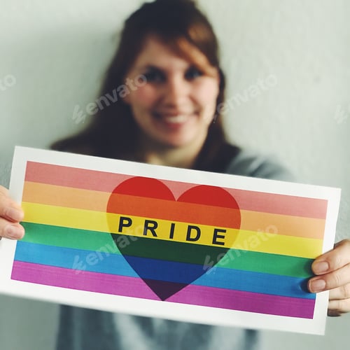 Preview: Woman holding rainbow flag, supporting LGBTQ+ rights