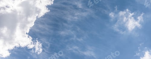 Preview: Blue sky background with a fluffy clouds
