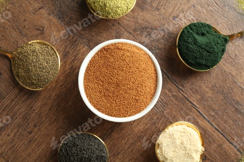 Preview: Different superfood powders on wooden table, flat lay