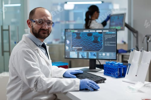 Preview: Portrait of scientist biochemist working in examination hospital laboratory