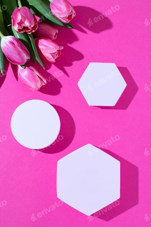 Preview: Pink podium for product display on pink with tulips flowers in hard light