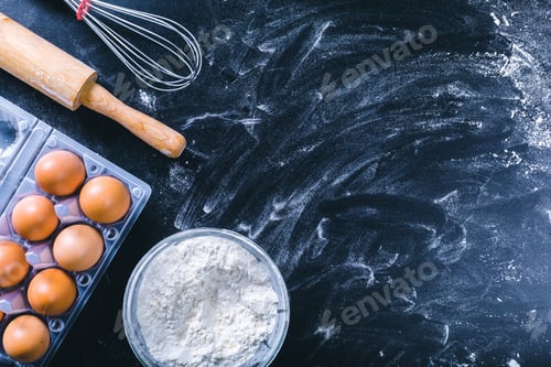 Preview: Ingredients and utensil for baking on the black board, top view