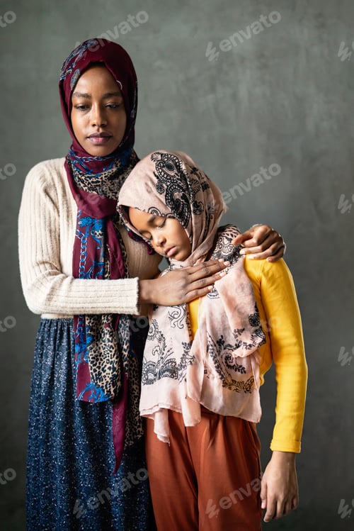 Preview: Arabian muslim family, mother and child spending time together at home.
