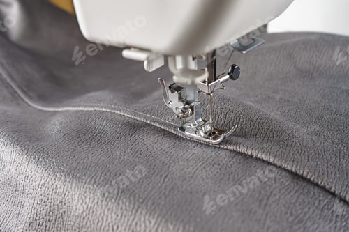 Preview: Modern Sewing Machine With Gray Velours Fabric Close Up