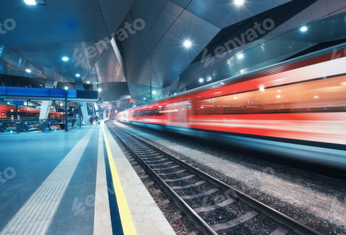 Preview: High speed train in motion on the railway station at night