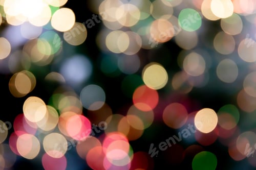 Preview: Dark background with a vibrant display of multicolored bokeh lights.
